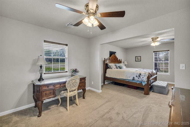 bedroom featuring light carpet, ceiling fan, baseboards, and visible vents