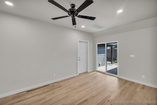 spare room featuring light wood-style flooring, a ceiling fan, visible vents, recessed lighting, and baseboards