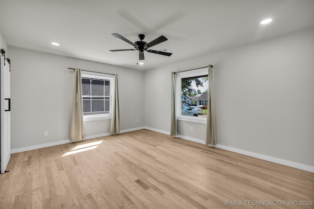 unfurnished room with baseboards, recessed lighting, light wood-type flooring, and a ceiling fan