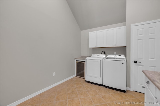 laundry room with cabinet space, independent washer and dryer, and baseboards