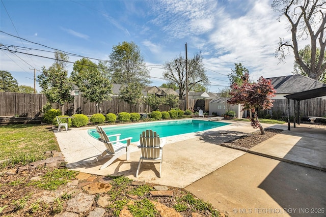 view of swimming pool featuring a patio area, a fenced backyard, and a fenced in pool