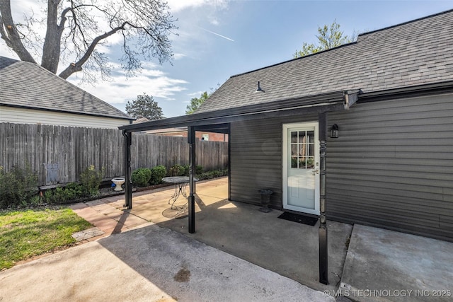 view of patio featuring fence