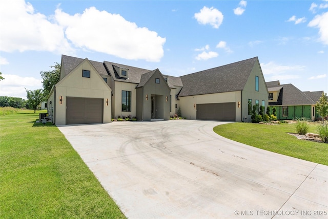 17822 E Patriot Dr, Owasso, OK 74055 - view of front of home featuring driveway, stucco siding, a shingled roof, and a front lawn