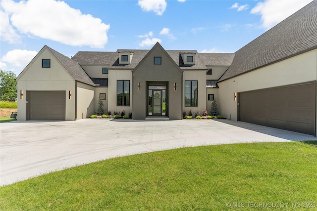 17822 E Patriot Dr, Owasso, OK 74055 - modern farmhouse with stucco siding, a standing seam roof, driveway, and a metal roof