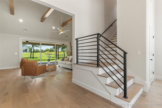 17822 E Patriot Dr, Owasso, OK 74055 - stairs featuring beamed ceiling, high vaulted ceiling, a ceiling fan, wood finished floors, and recessed lighting