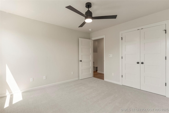 17822 E Patriot Dr, Owasso, OK 74055 - unfurnished bedroom featuring light carpet, a closet, and a ceiling fan