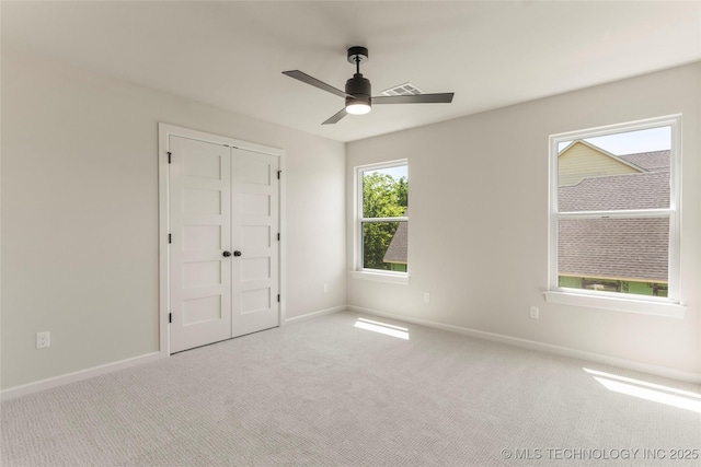 17822 E Patriot Dr, Owasso, OK 74055 - unfurnished bedroom with carpet floors, ceiling fan, and a closet