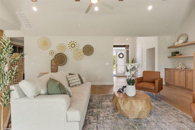17822 E Patriot Dr, Owasso, OK 74055 - living area featuring wood finished floors, a ceiling fan, and recessed lighting