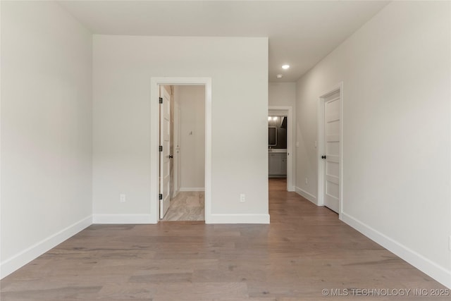 17822 E Patriot Dr, Owasso, OK 74055 - spare room featuring wood finished floors and recessed lighting