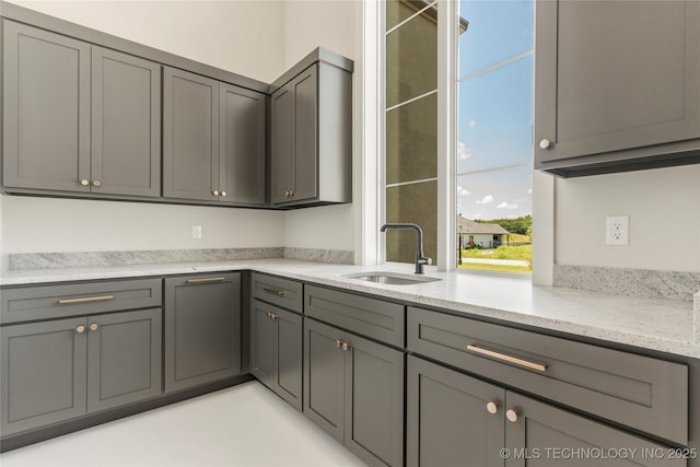 17822 E Patriot Dr, Owasso, OK 74055 - kitchen with gray cabinets and light stone counters