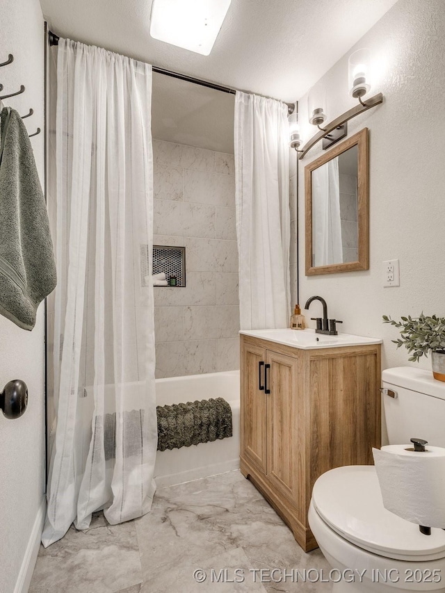 bathroom featuring shower / tub combo, marble finish floor, toilet, and vanity