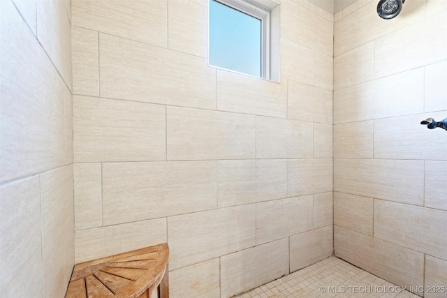 full bath featuring tiled shower