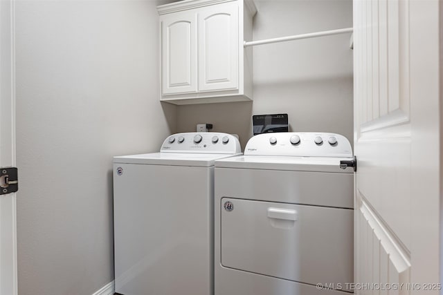 laundry area featuring cabinet space and washing machine and dryer