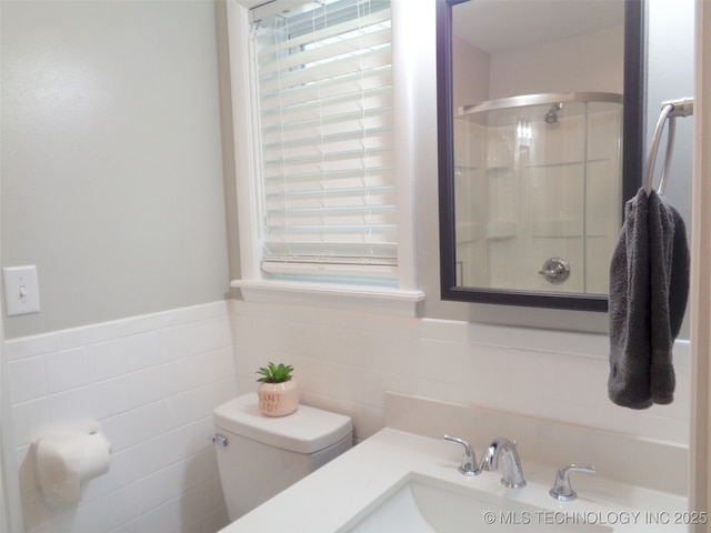 16893 E 116th St N, Owasso, OK 74055 - bathroom with a shower stall, tile walls, a sink, and toilet