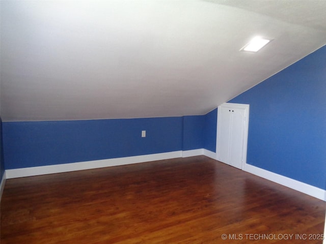 16893 E 116th St N, Owasso, OK 74055 - additional living space featuring baseboards, vaulted ceiling, and dark wood finished floors