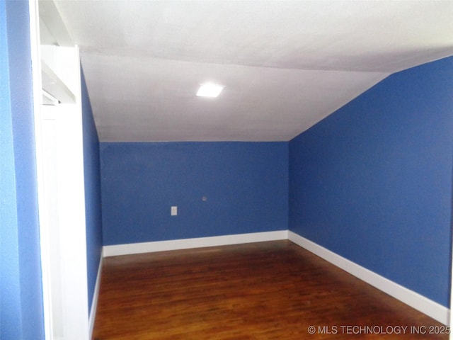16893 E 116th St N, Owasso, OK 74055 - additional living space featuring baseboards, vaulted ceiling, and dark wood-style floors