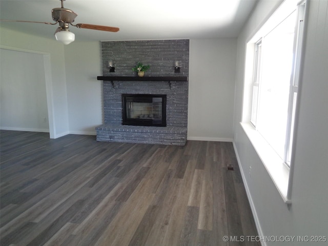 16893 E 116th St N, Owasso, OK 74055 - unfurnished living room featuring wood finished floors, a fireplace, a ceiling fan, and baseboards