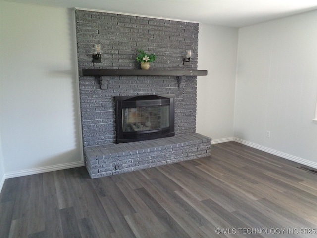 16893 E 116th St N, Owasso, OK 74055 - unfurnished living room featuring visible vents, baseboards, wood finished floors, and a fireplace