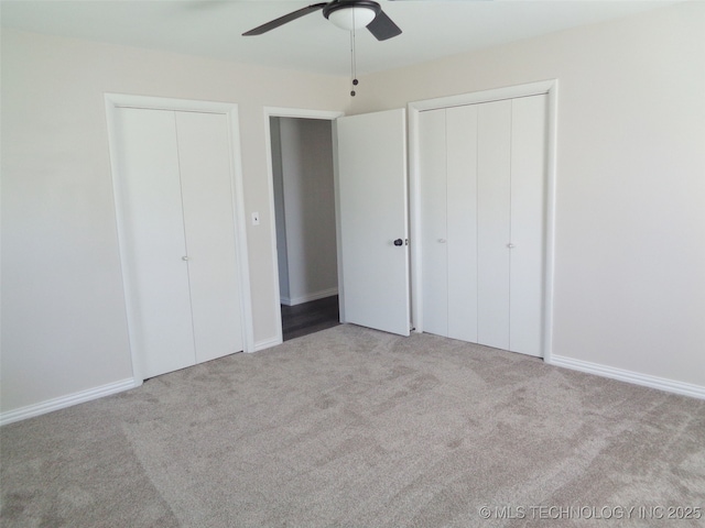 16893 E 116th St N, Owasso, OK 74055 - unfurnished bedroom featuring multiple closets, carpet flooring, ceiling fan, and baseboards