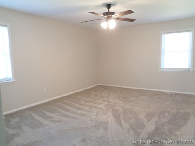 16893 E 116th St N, Owasso, OK 74055 - carpeted spare room with a wealth of natural light, baseboards, and ceiling fan