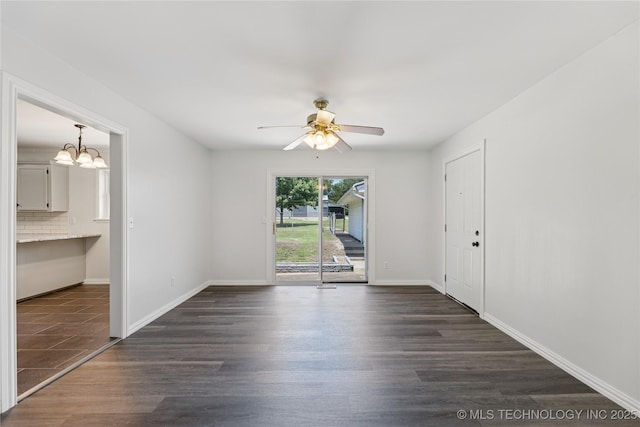 16893 E 116th St N, Owasso, OK 74055 - empty room featuring dark wood-style floors, ceiling fan, and a chandelier