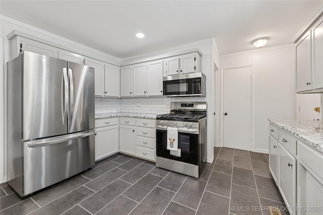 16893 E 116th St N, Owasso, OK 74055 - kitchen with appliances with stainless steel finishes, backsplash, white cabinets, ornamental molding, and recessed lighting