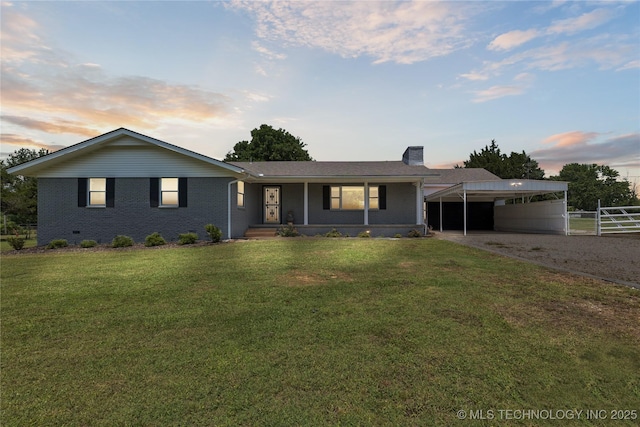 16893 E 116th St N, Owasso, OK 74055 - ranch-style house featuring gravel driveway, a carport, a chimney, brick siding, and a porch