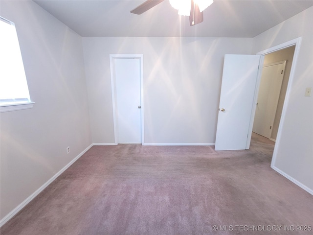 351 Hamilton Rd, Eufaula, OK 74432 - unfurnished bedroom with baseboards, a ceiling fan, and carpet