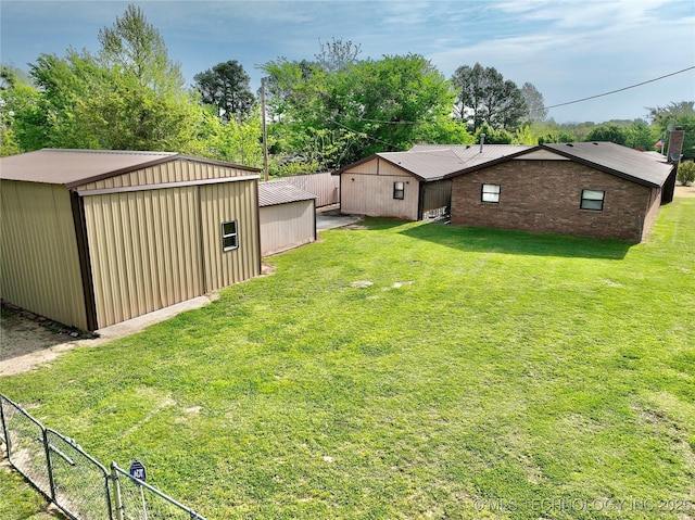 351 Hamilton Rd, Eufaula, OK 74432 - view of yard featuring an outdoor structure, fence, and an outbuilding