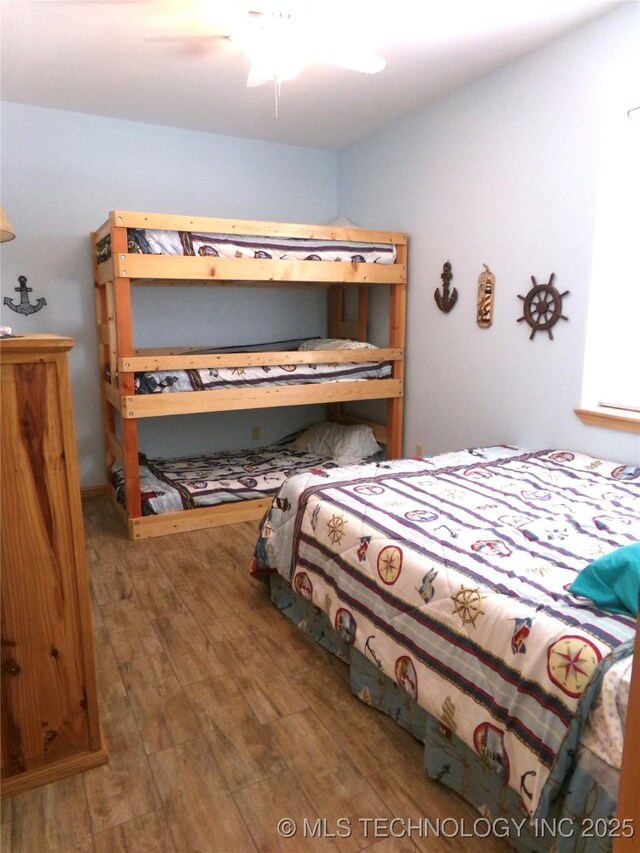 107349 S 4091st Rd, Checotah, OK 74426 - bedroom with wood finished floors and a ceiling fan