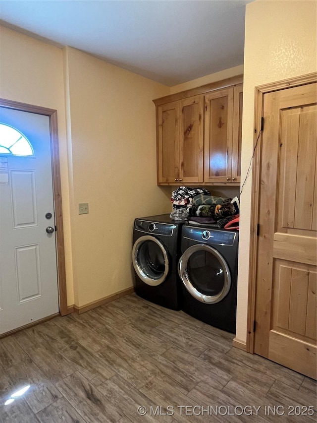 107349 S 4091st Rd, Checotah, OK 74426 - washroom featuring wood finished floors, washer and clothes dryer, and cabinet space