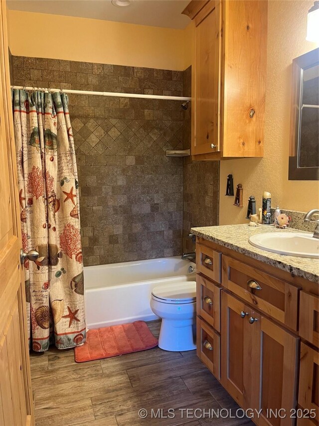 107349 S 4091st Rd, Checotah, OK 74426 - full bathroom with shower / tub combo, toilet, vanity, and wood finished floors