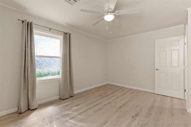 empty room featuring a ceiling fan, light wood-style floors, baseboards, ornamental molding, and visible vents