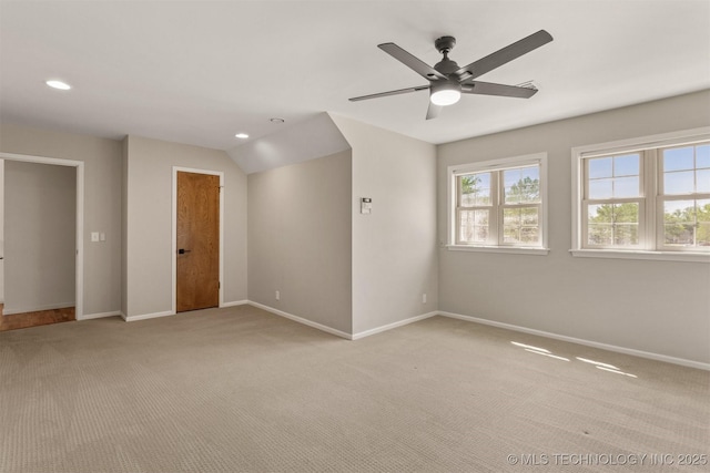 spare room featuring baseboards, recessed lighting, a ceiling fan, and light colored carpet