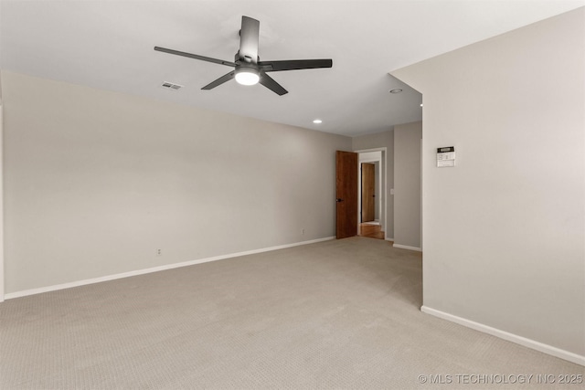 spare room with a ceiling fan, visible vents, baseboards, light carpet, and recessed lighting