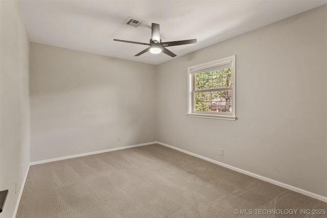 unfurnished room featuring ceiling fan, carpet flooring, baseboards, and visible vents