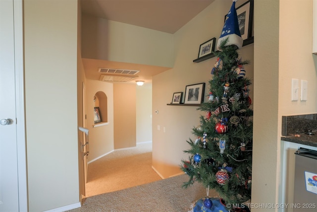 corridor featuring visible vents and carpet