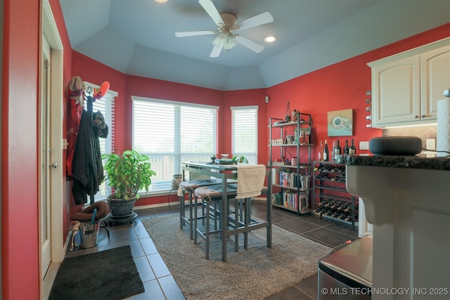 dining space with ceiling fan, dark tile patterned floors, and recessed lighting