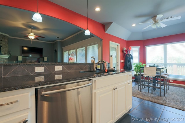 kitchen featuring a sink, white cabinetry, a ceiling fan, dishwasher, and dark tile patterned flooring