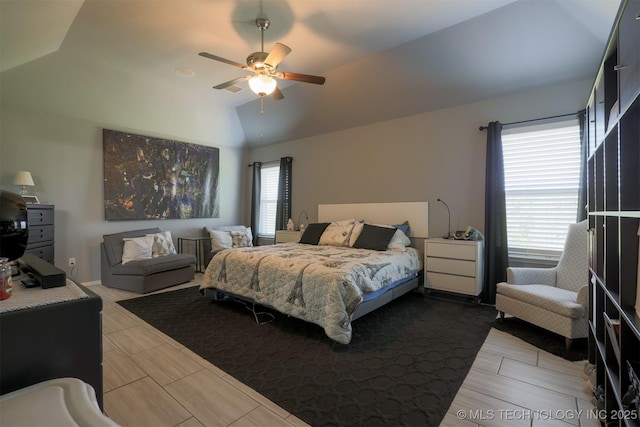 bedroom with lofted ceiling and ceiling fan