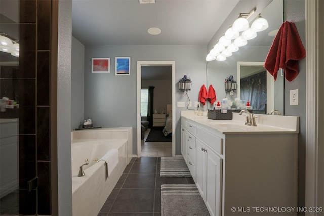 bathroom featuring tile patterned floors, a sink, double vanity, and a tub with jets