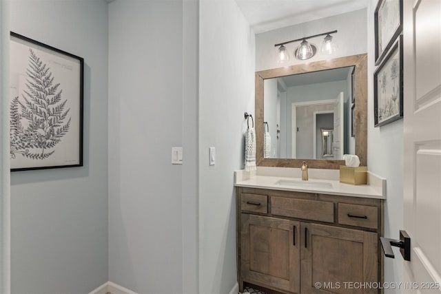 bathroom featuring vanity and baseboards