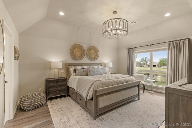 bedroom with light wood-style floors, vaulted ceiling, a chandelier, recessed lighting, and baseboards