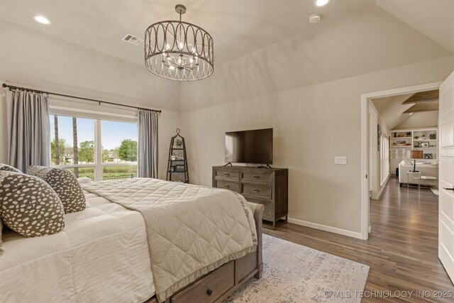 bedroom with vaulted ceiling, wood finished floors, a chandelier, baseboards, and recessed lighting