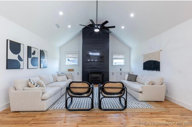 9520 N 144th Ave E, Owasso, OK 74055 - living area with a ceiling fan, a fireplace, wood finished floors, baseboards, and recessed lighting