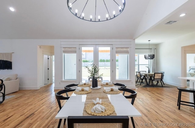 9520 N 144th Ave E, Owasso, OK 74055 - dining space featuring a chandelier, french doors, light wood-style flooring, baseboards, and lofted ceiling