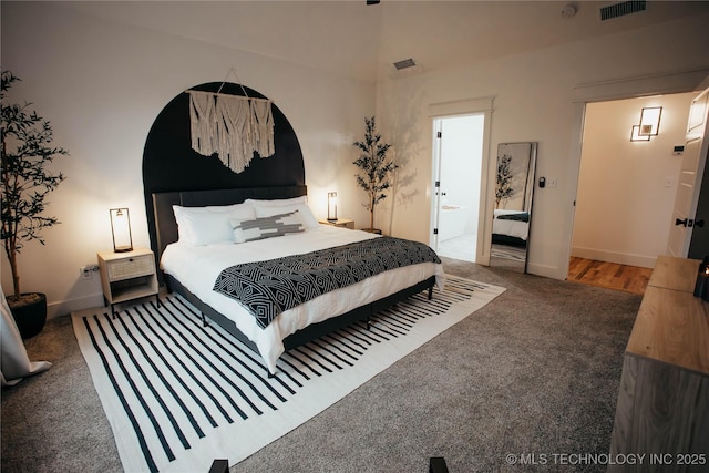9520 N 144th Ave E, Owasso, OK 74055 - carpeted bedroom with baseboards and ensuite bath