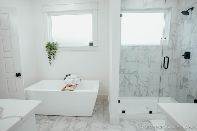 9520 N 144th Ave E, Owasso, OK 74055 - full bathroom featuring vanity, a marble finish shower, marble look tiles, and a freestanding bath