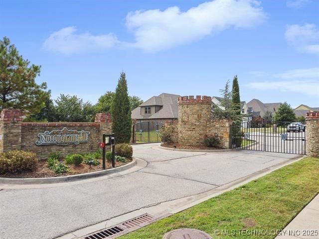 9520 N 144th Ave E, Owasso, OK 74055 - community / neighborhood sign featuring a gate, fence, a residential view, and driveway