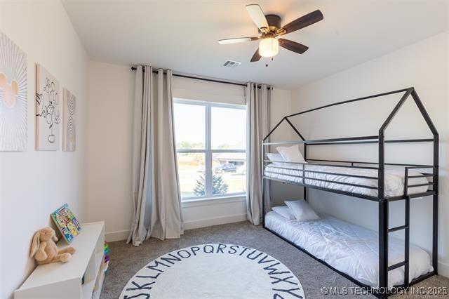 9520 N 144th Ave E, Owasso, OK 74055 - bedroom featuring carpet, baseboards, and ceiling fan